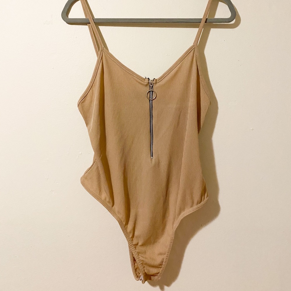 tan body suit